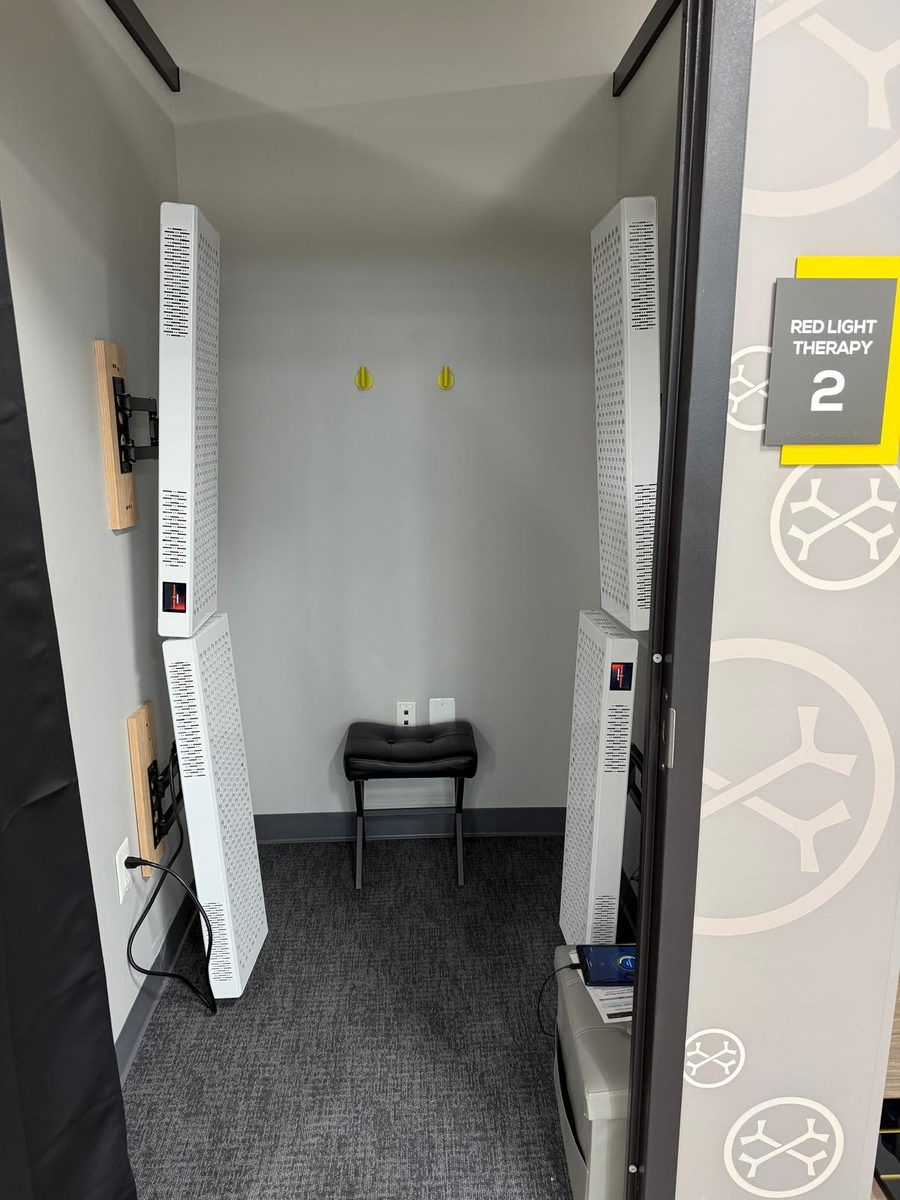 Standing Red Light Therapy panels at OsteoStrong Tysons Corner